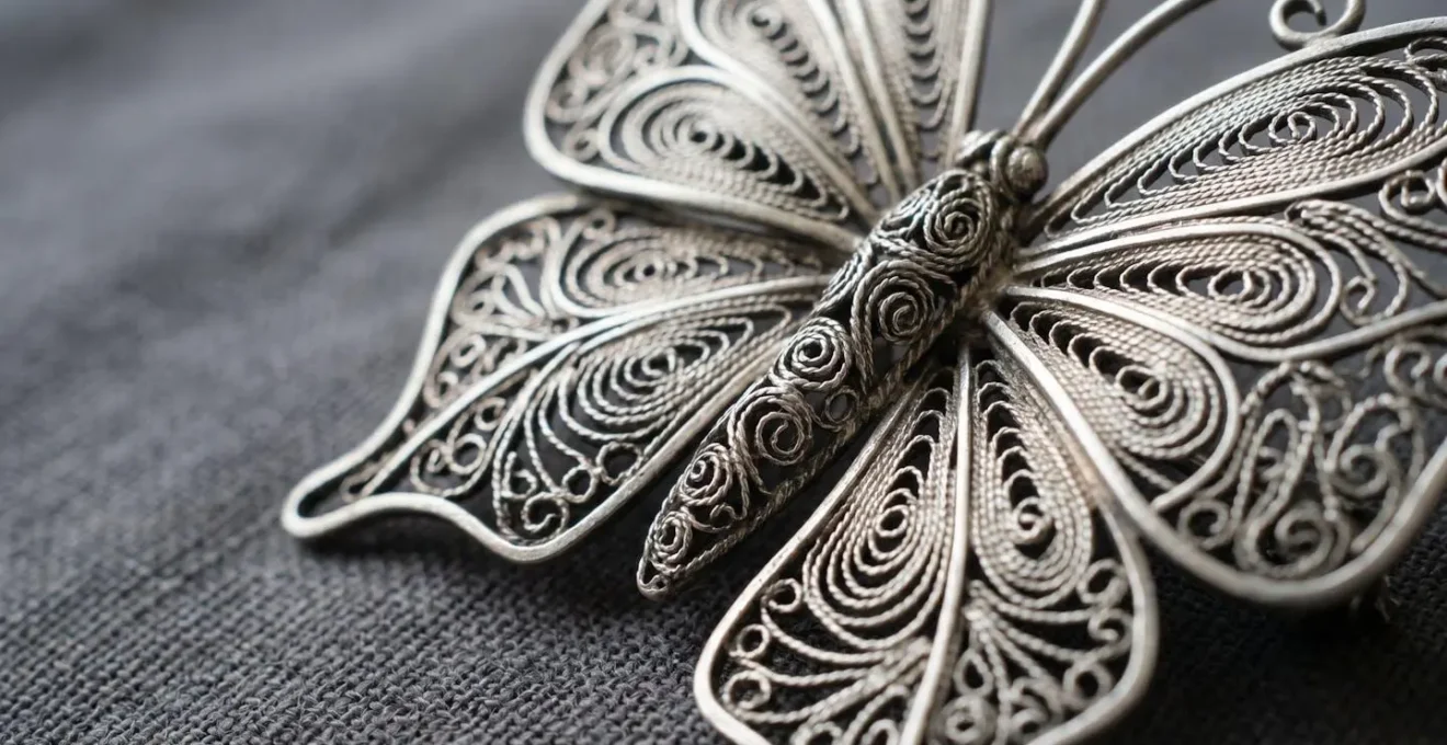 Delicate Macedonian filigree silver butterfly brooch showcasing intricate handcrafted wire patterns